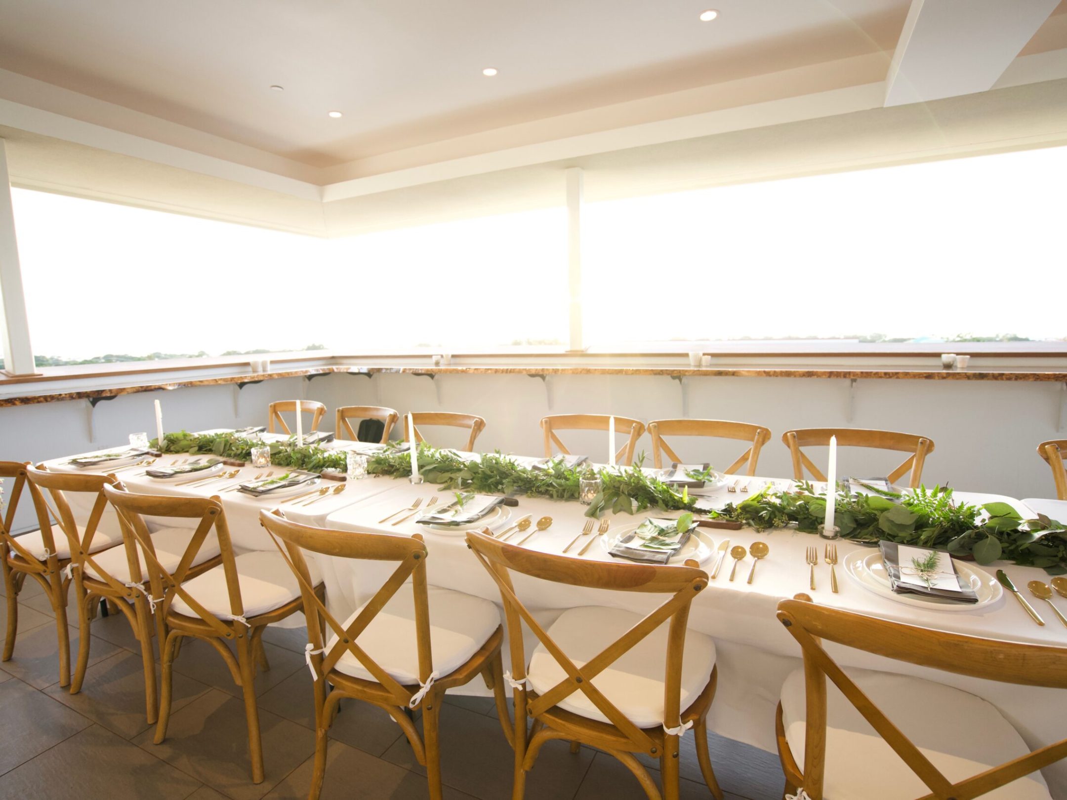 a dining room table in front of a window