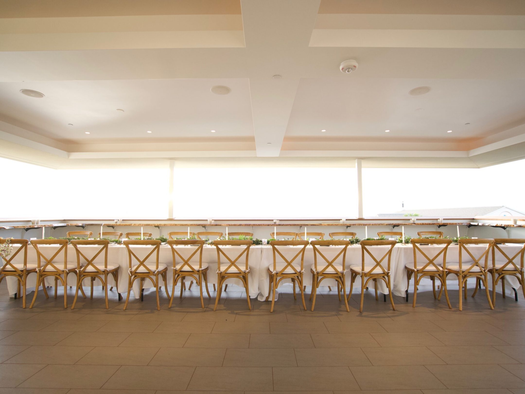 a group of people standing on top of a wooden chair