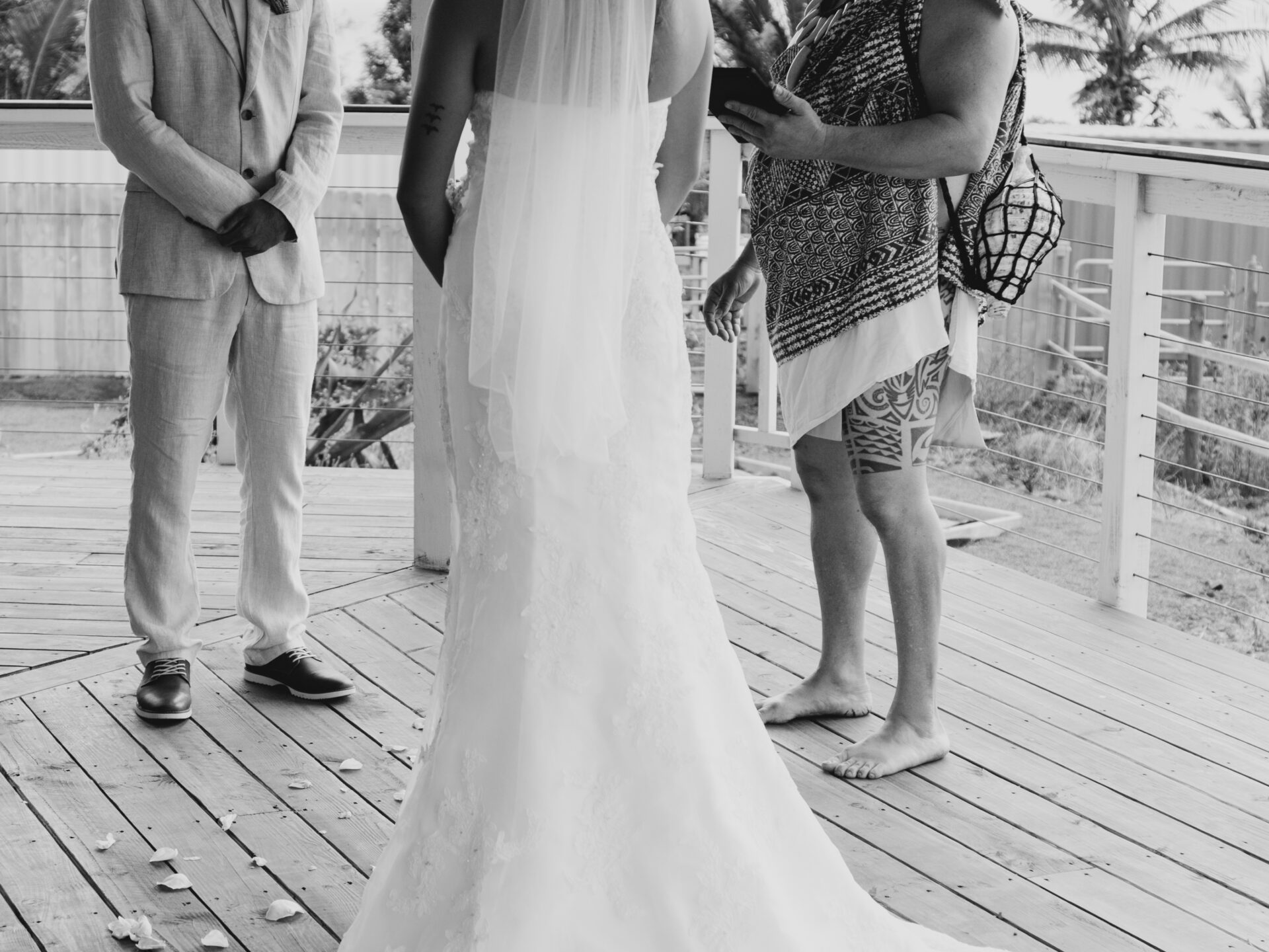 a bride, groom, and an officiant