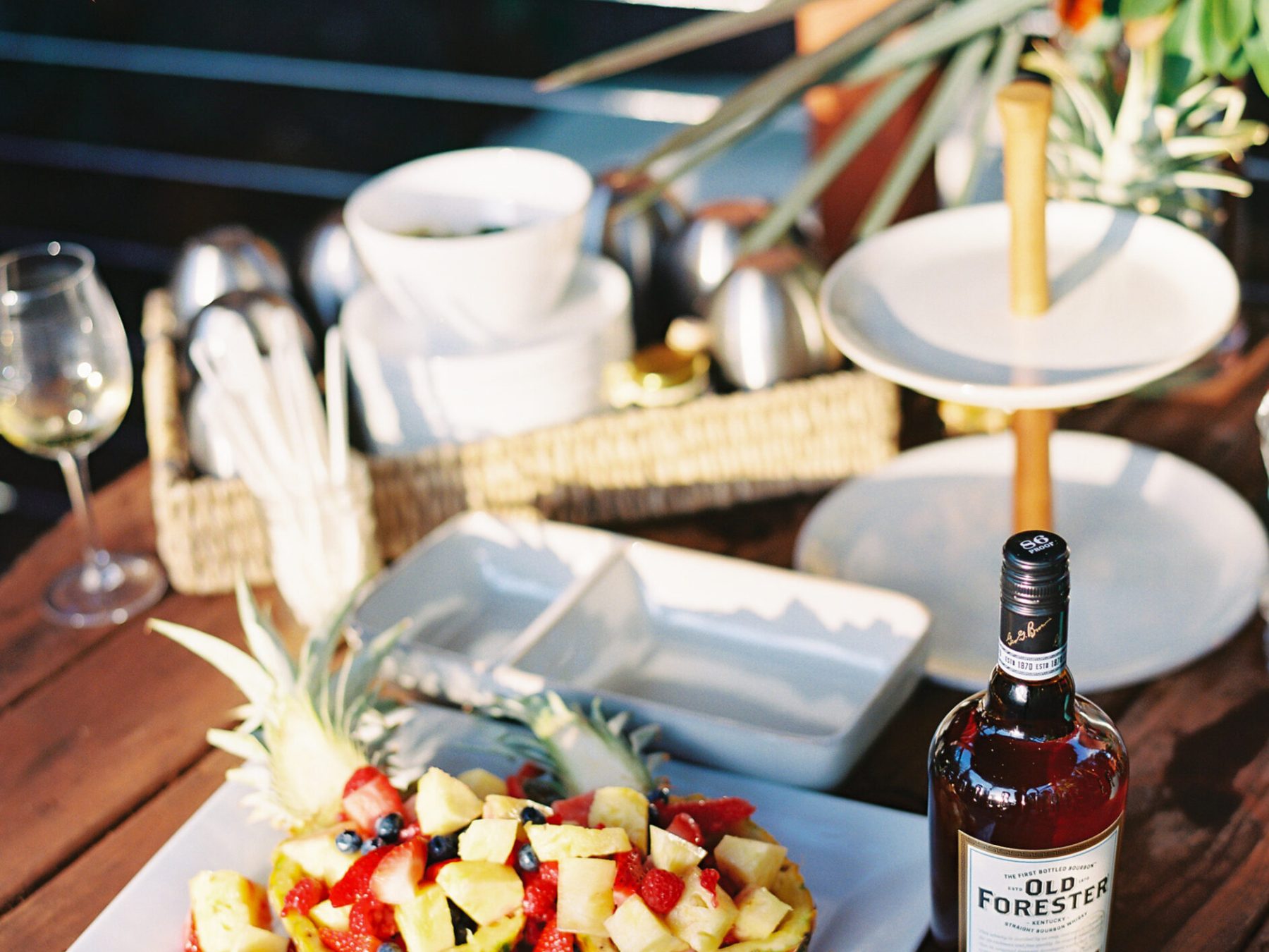 a bottle of wine sitting on top of a wooden table
