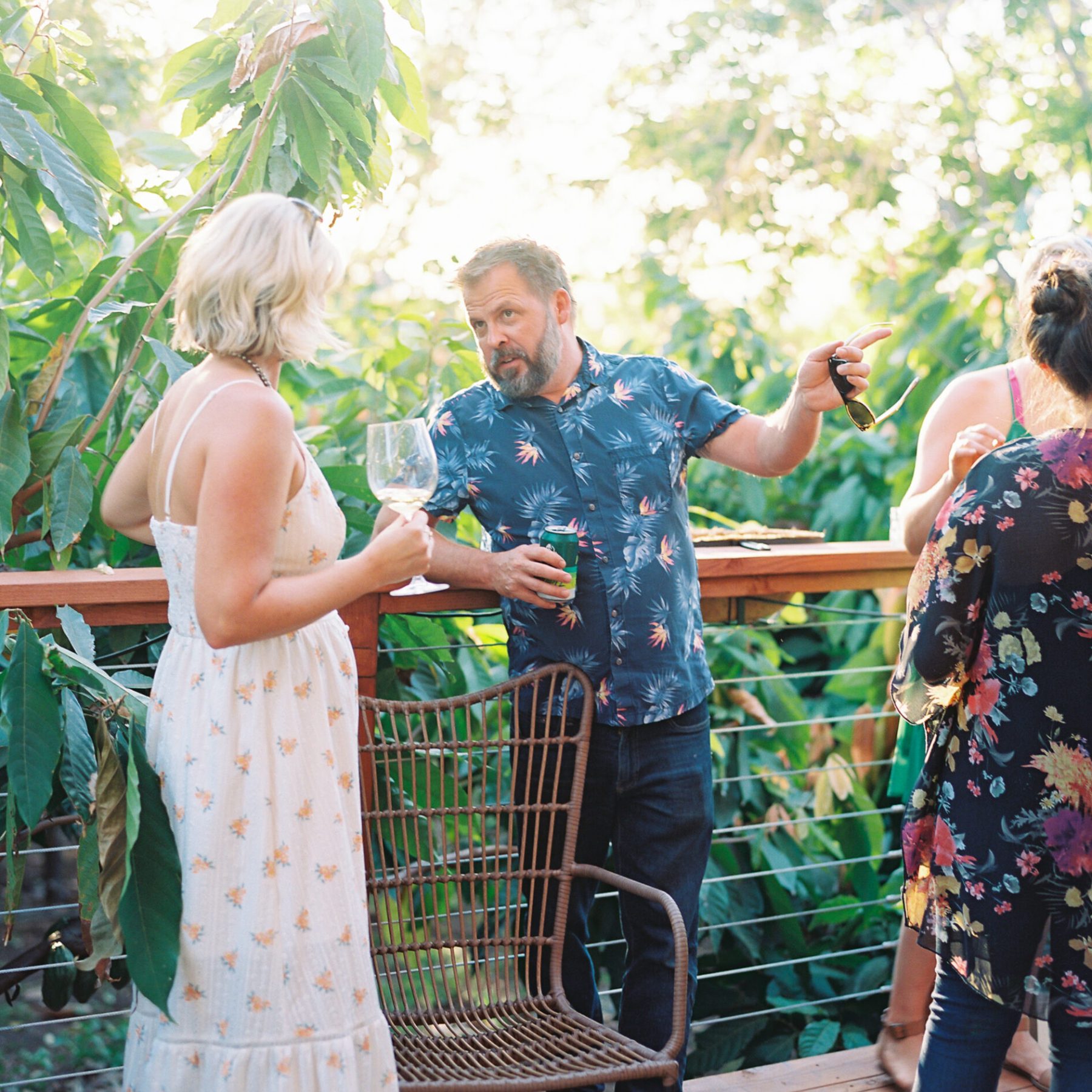 a group of people standing next to a fence