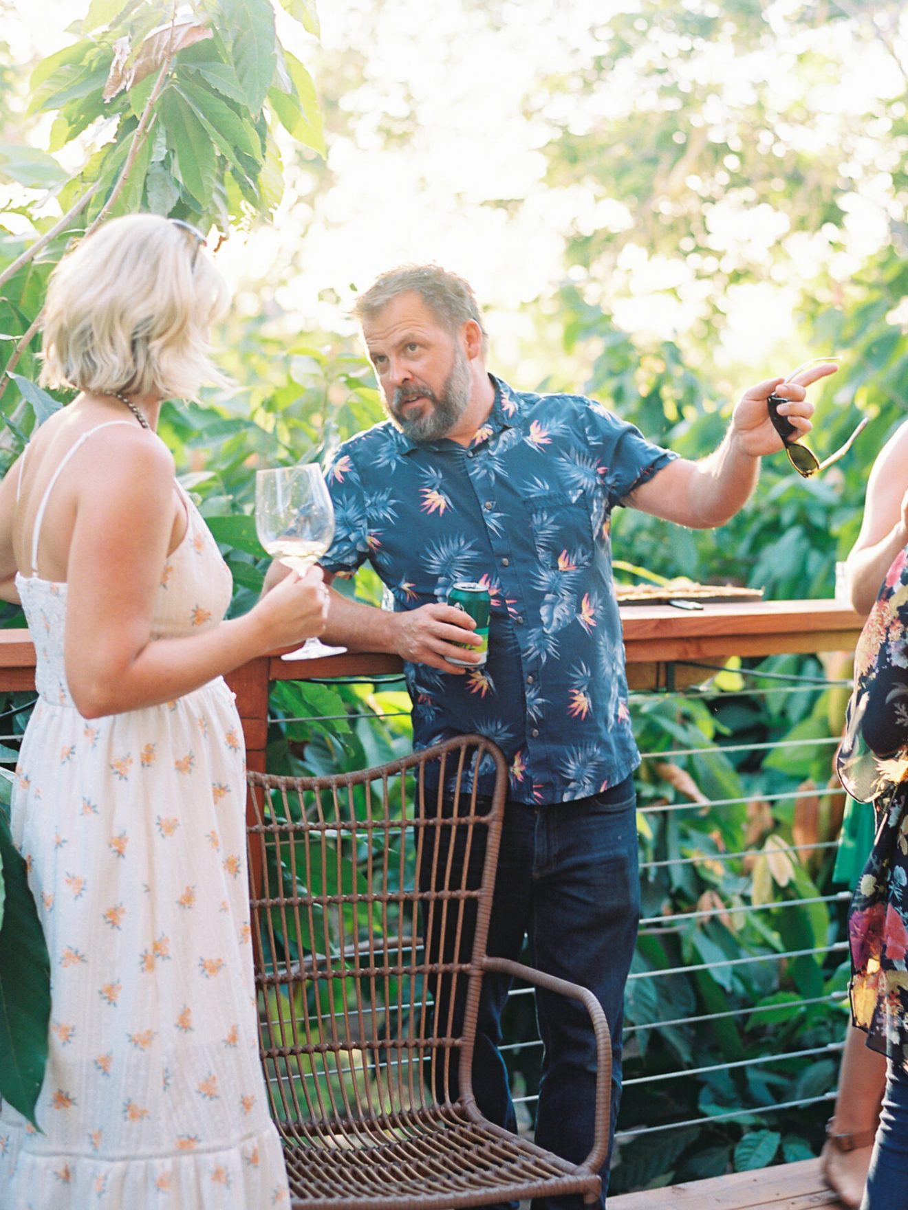 a group of people standing next to a fence