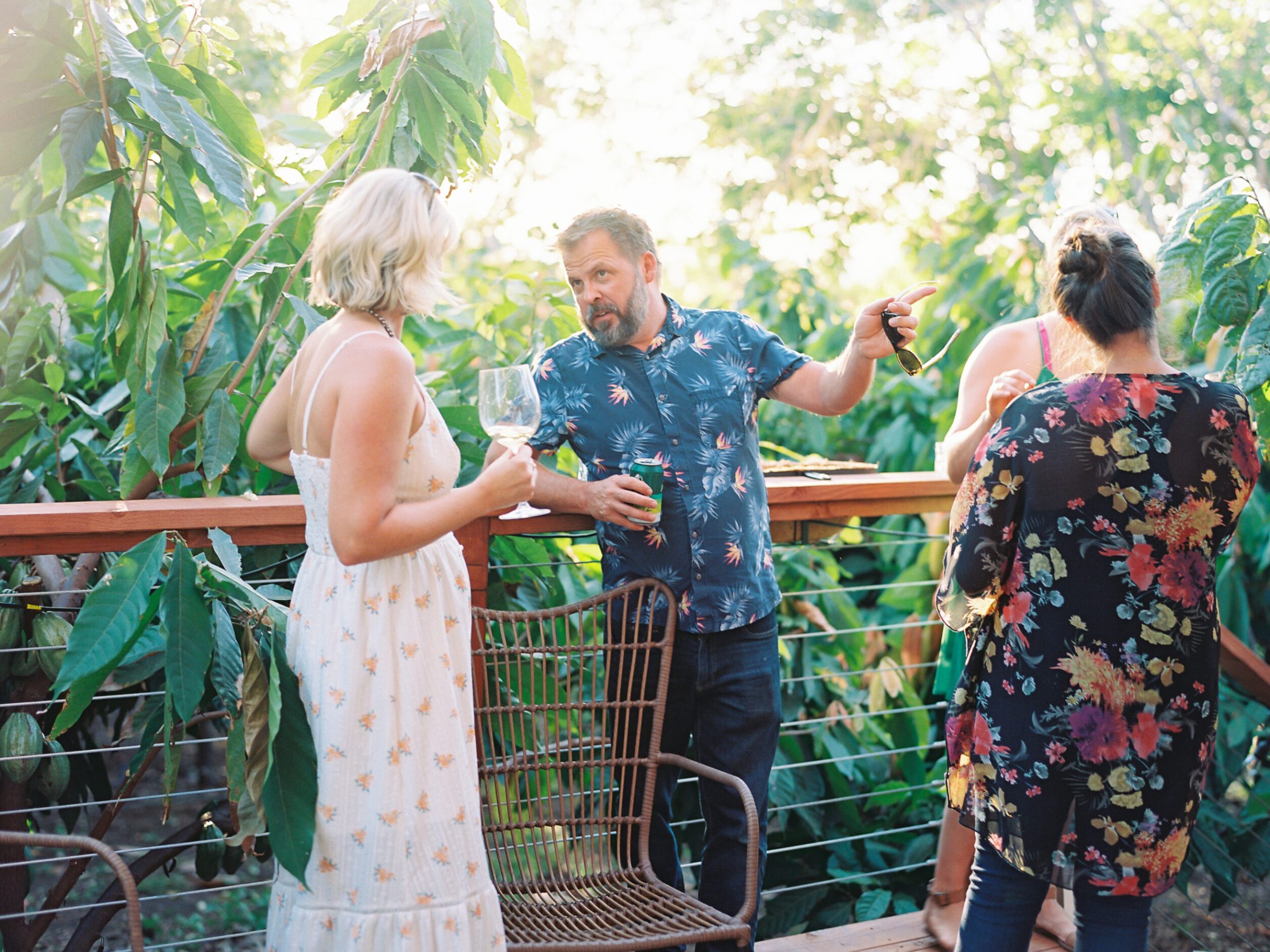 a group of people standing next to a fence