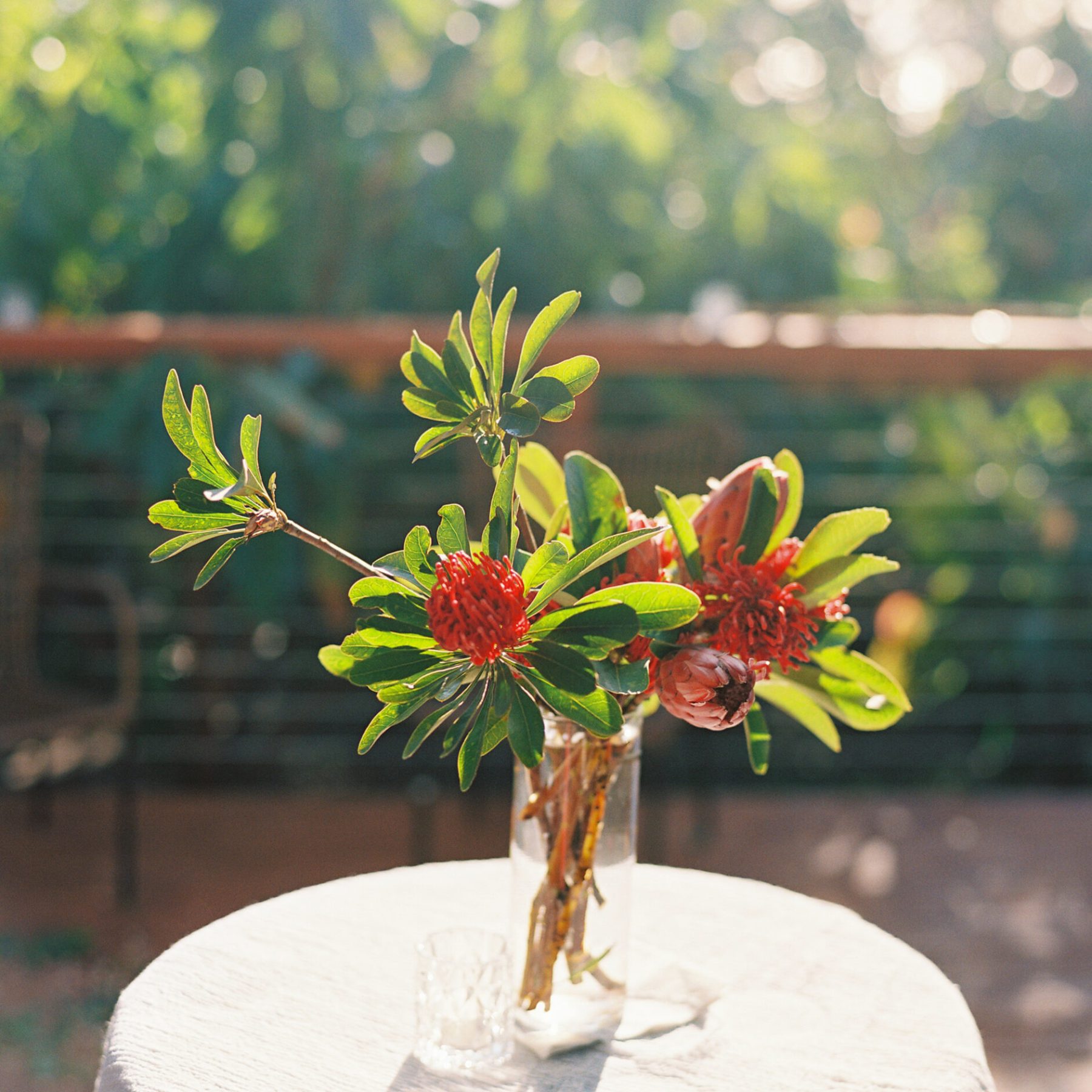 a vase of flowers sitting on a table