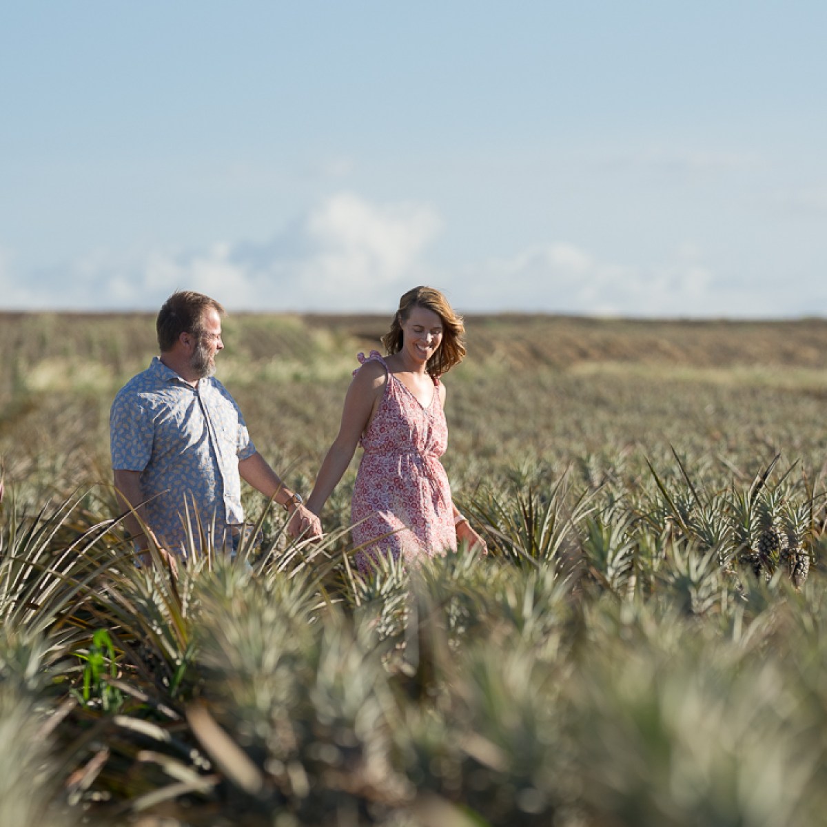 a person standing on top of a grass covered field