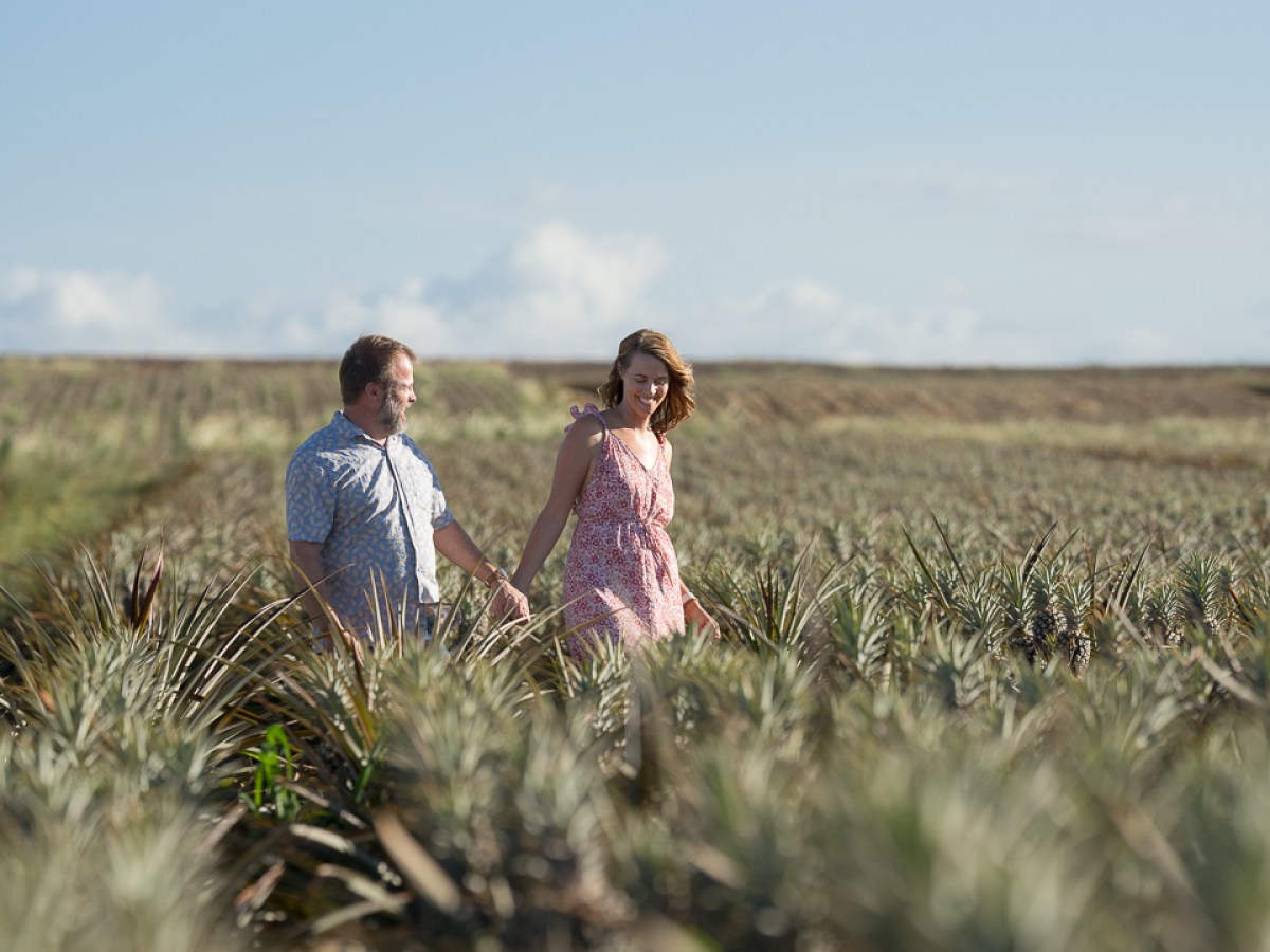 a person standing on top of a grass covered field